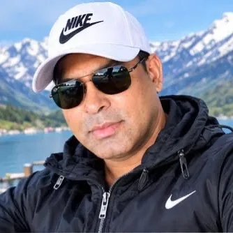 Portrait of Minto Chowdhury in a white cap and sunglasses